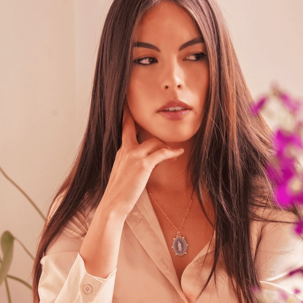 Model wearing the Reina virgin de Guadalupe necklace